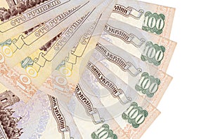 100 Ukrainian hryvnias bills lies isolated on white background with copy space stacked in fan shape close up