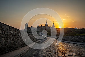 Ukrainian Kamianets-Podilskyi fortress at sunset