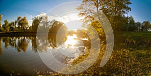 Ukrainian landscape of forest and river at sunset