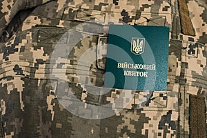 Ukrainian military id document for soldiers in pocket on pixel military uniform