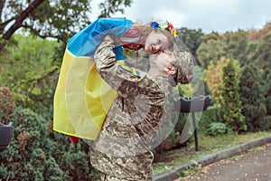 The Ukrainian military man picked up his little daughter