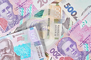 Ukrainian money on blue background. Payment of pensions, salaries