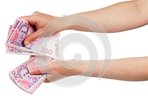 Ukrainian money in hands