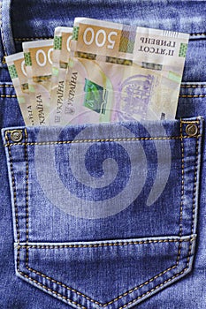 Ukrainian money. New banknotes five hundred hryvnia bills UAH in the back pocket of blue jeans. Money concept