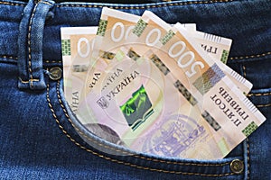 Ukrainian money. New banknotes five hundred hryvnia bills UAH in the back pocket of blue jeans. Money concept