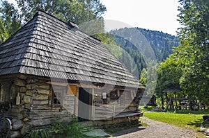 Ukrainian old-fashioned wooden house among the Carpathian mountains in Kolochava village