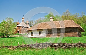 Ukrainian old log hut and church
