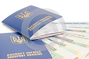 Ukrainian passports on a background of travel visas closeup