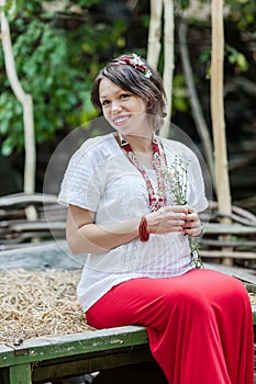 Ukrainian pregnant woman in traditional embroidered shirt