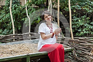 Ukrainian pregnant woman in traditional embroidered shirt