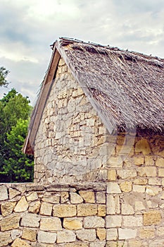 Ukrainian stone house under a thatched roof