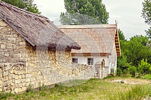 Ukrainian stone house under a thatched roof