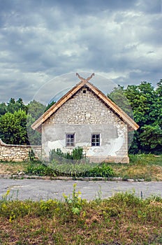 Ukrainian stone house under a thatched roof