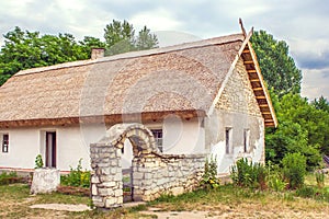 Ukrainian stone house under a thatched roofs