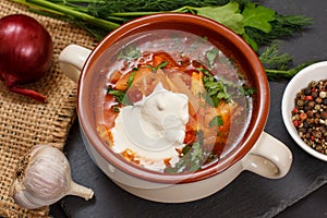 Ukrainian traditional borsch with sour cream and spices