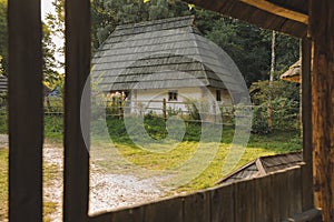 Ukrainian village rustic country side clay house yard from frame work wooden porch foreground outside