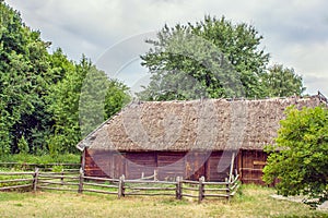 Ukrainian wooden barn Thatched locked up