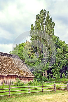 Ukrainian wooden barn Thatched locked up