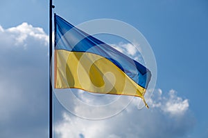 Ukrainian yellow and blue flag on a background of blue sky