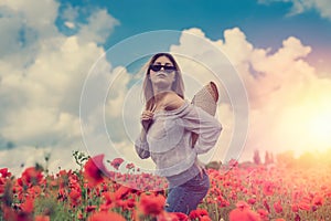 ukrainian young lady in white blouse in the field of poppies