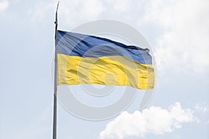 ukranian flag on a pole over beautiful sky photo
