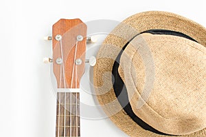 Ukulele and brown hat.