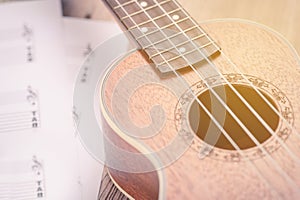 Ukulele and musical paper notes