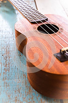 Ukulele on the old wood table