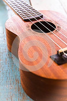Ukulele on the old wood table