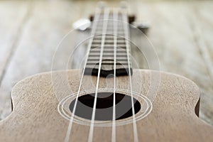 Ukulele on the rustic wooden table