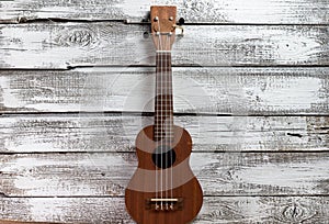 ukulele on a wooden background