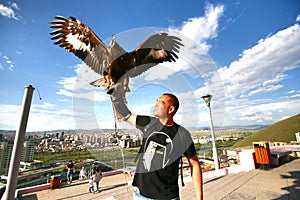 Ulaanbaatar Mongolia July 3 ,2016 - The man catch a Hawk at Zaisan Memorial