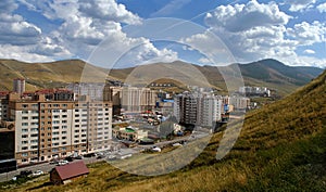 Ulan Bator, the capital of Mongolia. City panorama on mountains background. Blue sky and beautiful clouds. Asia.