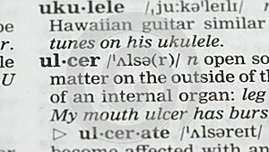 Ulcer word on vocabulary page in english, cancer prevention and healthcare