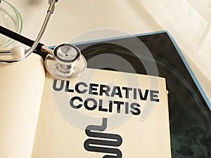 Ulcerative colitis is shown using the text and picture of intestine in the book photo