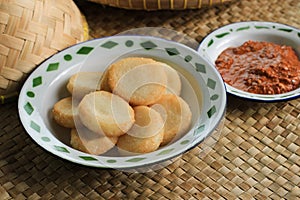 Ulen Ketan, Indonesian Traditional Snack Made from Steam Sticky Rice, Compressed or Shaped and then Deep Fried, Served with Sambal