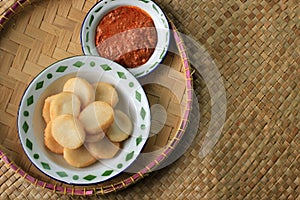 Ulen Ketan, Indonesian Traditional Snack Made from Steam Sticky Rice, Compressed or Shaped and then Deep Fried, Served with Sambal