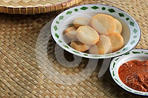 Ulen Ketan, Indonesian Traditional Snack Made from Steam Sticky Rice, Compressed or Shaped and then Deep Fried, Served with Sambal