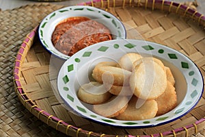 Ulen Ketan, Indonesian Traditional Snack Made from Steam Sticky Rice, Compressed or Shaped and then Deep Fried, Served with Sambal