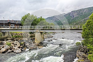 UlsÃ¥k bridge Moen bru with flowing beautiful river lake, Norway