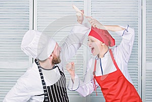 Ultimate cooking challenge. Culinary battle of two chefs. Couple compete in culinary arts. Kitchen rules. Who cook
