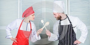 Ultimate cooking challenge. Culinary battle of two chefs. Couple compete in culinary arts. Kitchen rules. Culinary