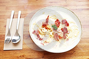 Ultimate Pasta  spaghetti carbonara recipe is Traditional Italian food  sprinkle on top with bacon  and Fresh Parsley in a cream