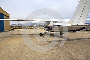 Ultra-light aircraft at the airfield in the parking lot near the hangar. Close up