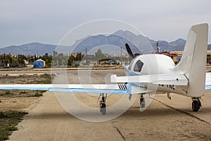 Ultra light aircraft at the airport against the backdrop of the mountains . Close up
