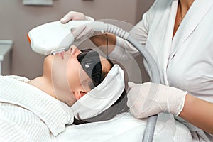 ultraformer lifting. Face Skin Care. Close-up Of Woman Getting Facial Hydro Microdermabrasion Peeling Treatment At