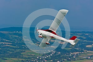 Ultralight airplane in flight photo