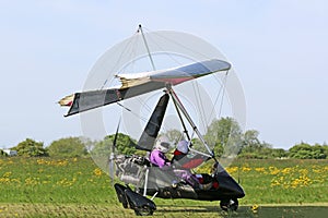 Ultralight airplane on a grass airfield