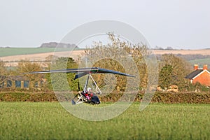 Ultralight airplane on a grass airfield