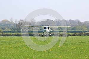 Ultralight airplane taxiing on a farm strip